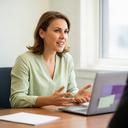 Lolo Mcshea, head of client services, speaking with a client at a desk
